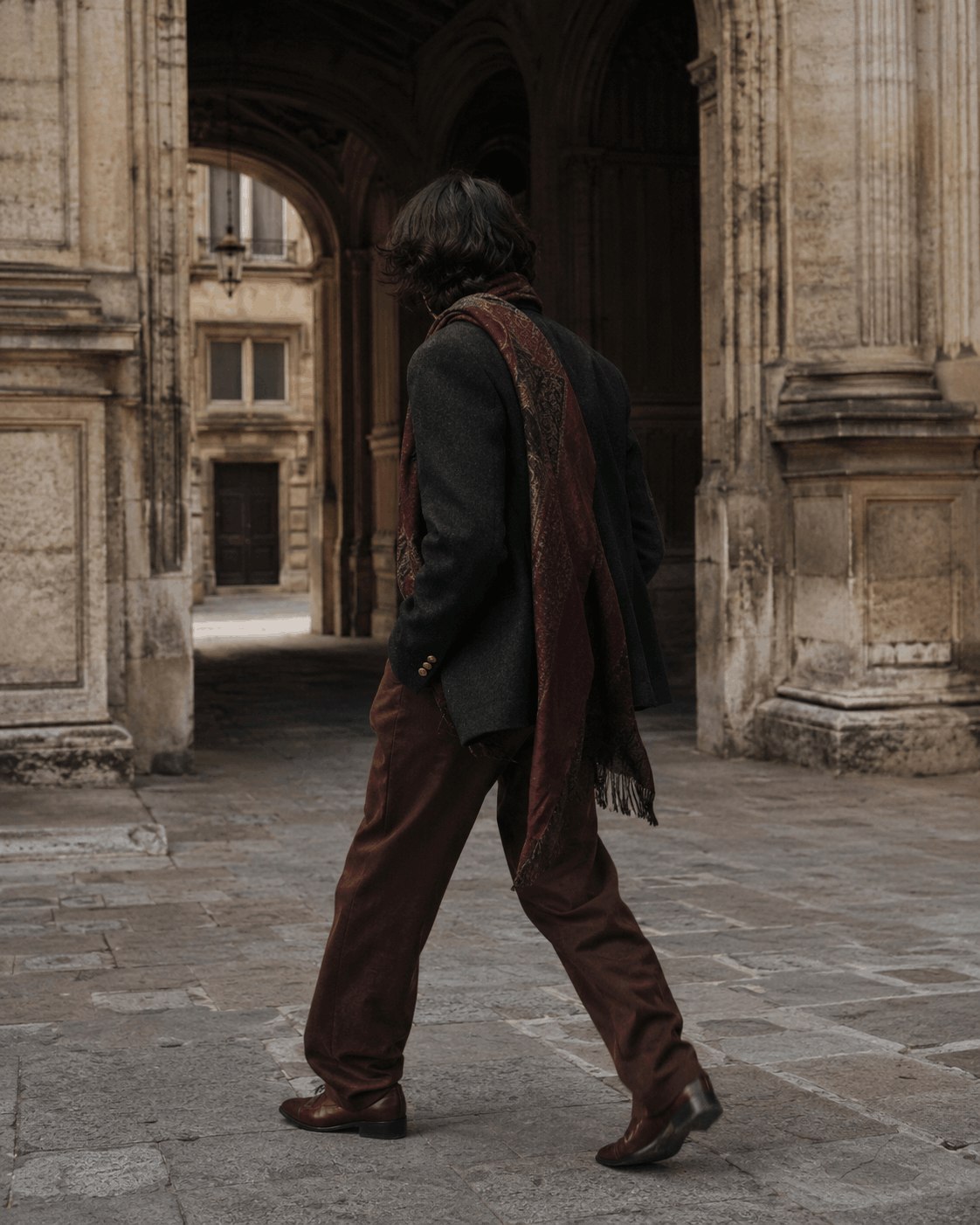 Layered fashion in a historic European arcade